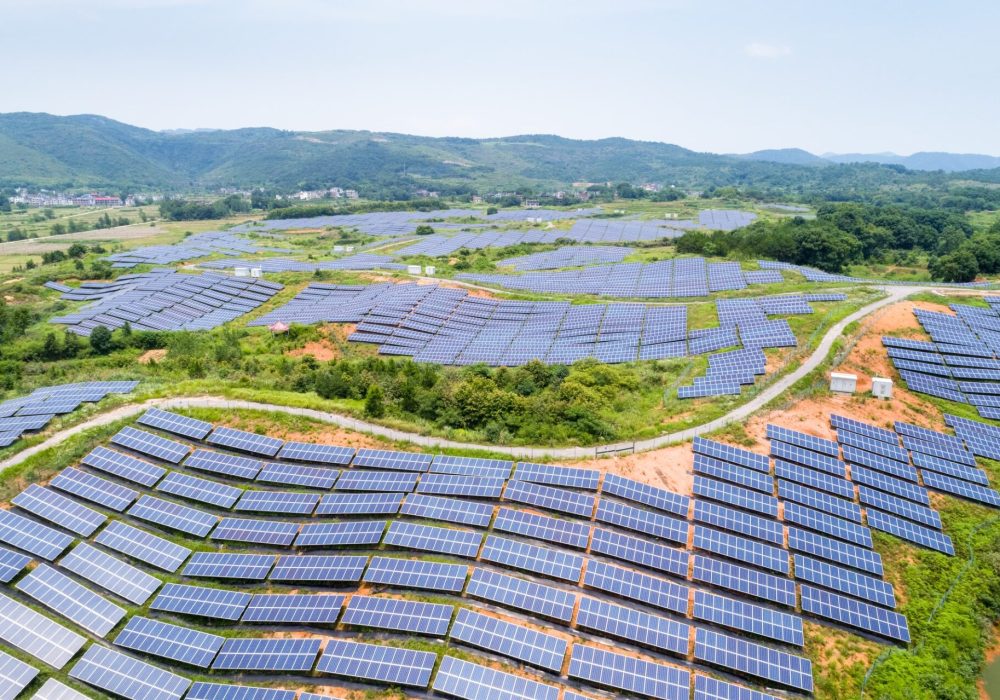 solar-power-station-on-hillside-aerial-view-of-renewable-energy.jpg